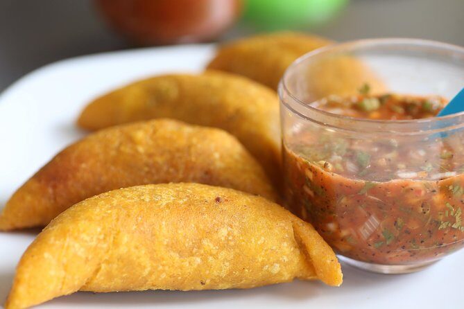 Private Street Food Tour, Eat like a Local in Medellin! - Stop 2: Plaza Botero and How Food Connects to Local Business