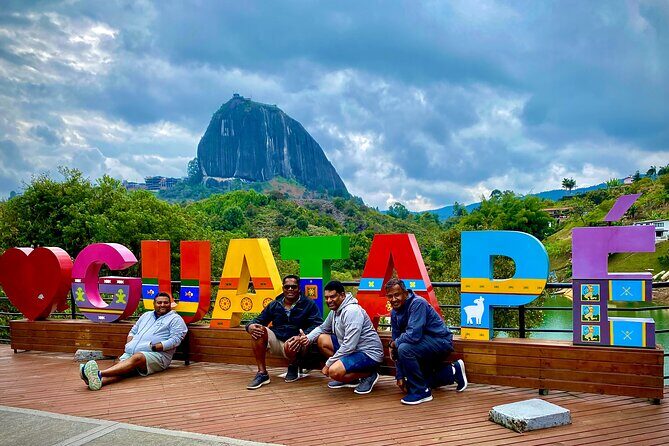 Private Tour to Guatapé with Helicopter Boat Ride and Roca Peñol - Guatapé town streets: art, shops, and a real pause