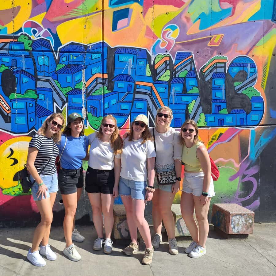 Shared Tour to Comuna 13 & Aurora Cable Car in Medellin - Group size and guide language: what you can expect