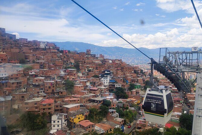 Tour of Medellin with Extended Visit to Commune 13 and Book-Art - Escaleras Electricas de la Comuna 13: art, escalators, and hard context